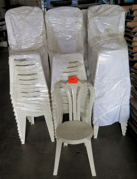 Qty 90 White Plastic Stackable Chairs - Oahu Auctions