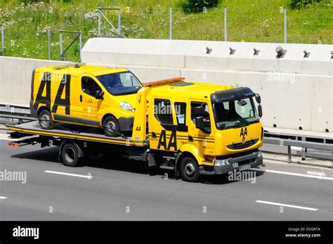 Aa Van On Aa Breakdown Recovery Lorry Stock Photo Alamy