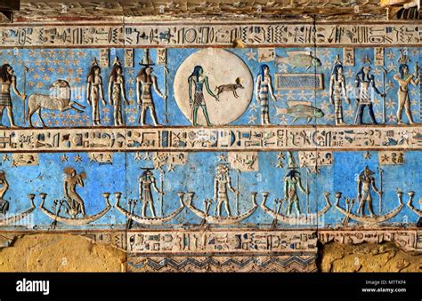 Hieroglyphic carvings and paintings on the interior walls of an ancient egyptian temple in ...