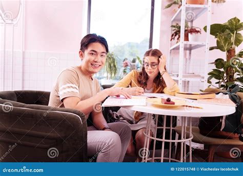 Two Students Having Desserts While Preparing For Test Stock Photo