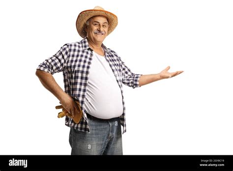 Smiling Mature Farmer Showing With Hand Isolated On White Background