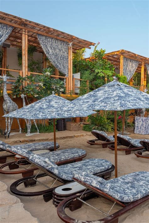Dior at Dubai's Nammos Beach Club | Blue patio, Beach design, Bamboo ...