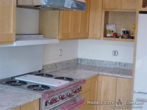 Cool White Kitchen With Bianco Romano Granite