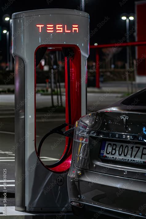 Tesla model s at Supercharger station TESLA. Vertical photo. Belgrade ...