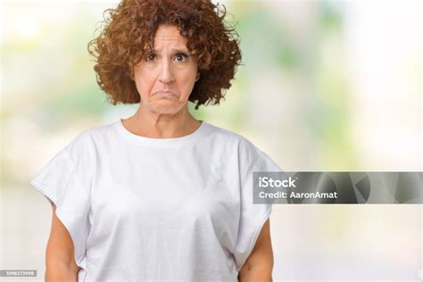 Beautiful Middle Ager Senior Woman Wearing White Tshirt Over Isolated