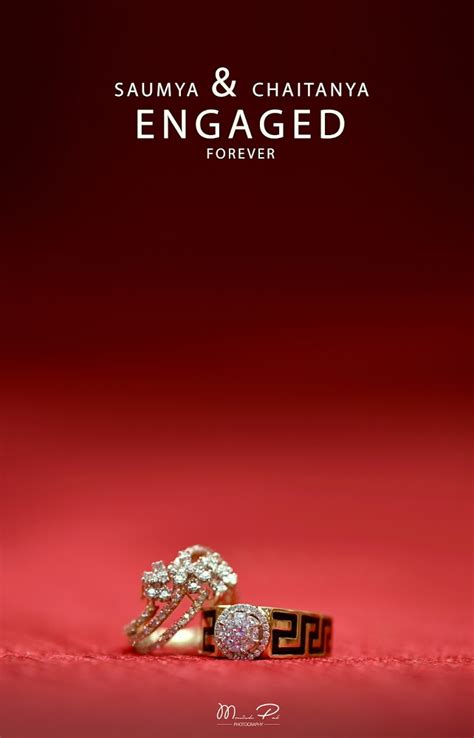 Two Wedding Rings Sitting On Top Of A Red Surface With The Caption