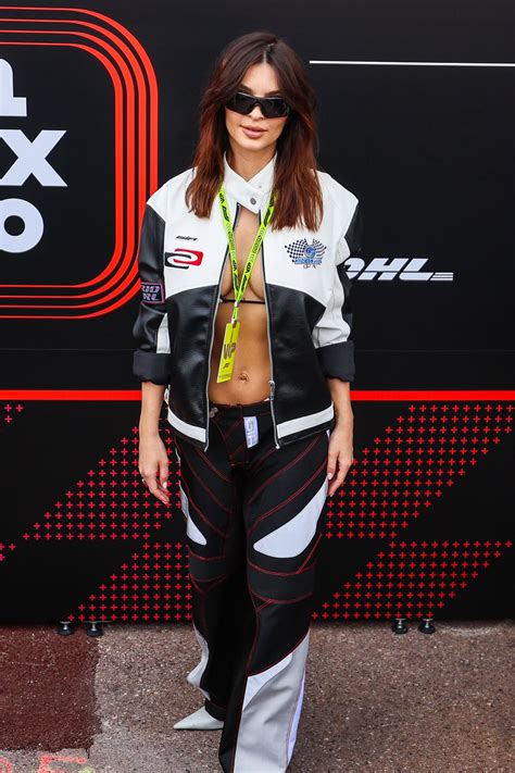 Emily Ratajkowski Wears A Racing Suit And Bikini At Grand Prix