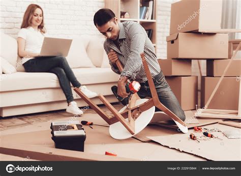 Assemble Furniture Man Repairing Chair Man Collects Chair Furniture