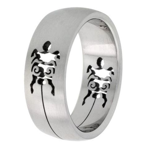 A Wedding Ring With An Image Of A Scorpion On It S Side And Black Ink In