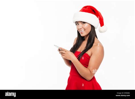 Portrait Of A Smiling Pretty Asian Woman In Red Christmas Costume