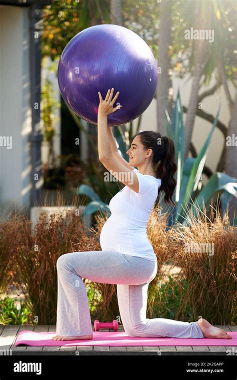 Staying Fit Throughout Her Pregnancy Shot Of A Young Pregnant Woman