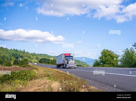 Old Classic American Bonnet Blue Big Rig Semi Truck With Vertical