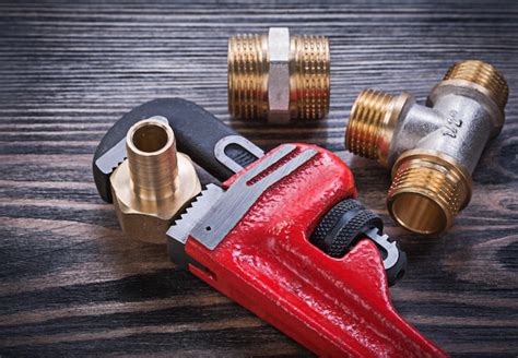 Premium Photo Monkey Wrench Brass Equal Tee Nipple Hose Connectors On