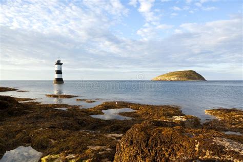 Puffin Island and Penmon Point Lighthouse Stock Photo - Image of penmon ...