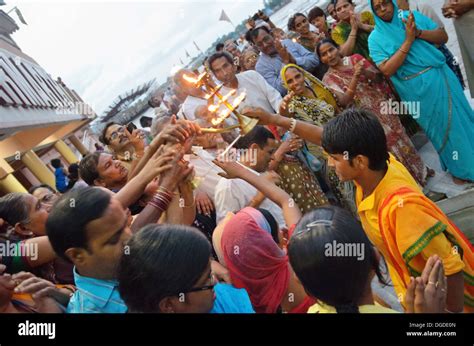 Devotees Taking Heat Of The Sacred Fire From The Aarti Evening Ganga