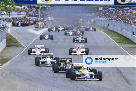 Nigel Mansell Williams FW11 Honda Leads Ayrton Senna Lotus 98T