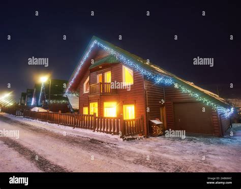 Snowy Scene Of Cottage At Night High Resolution Stock Photography and ...