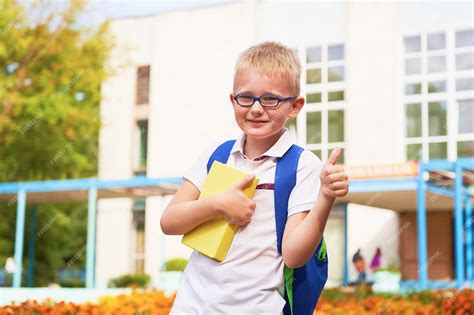 Premium Photo The Child Goes To Primary School Portrait Of A Happy