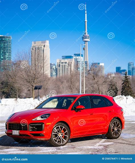 Red Porsche Cayenne in a Parking Low on a Sunny Day during the Winter ...