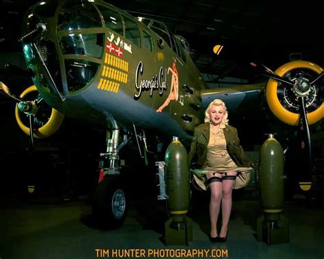 A Woman Sitting In Front Of An Airplane