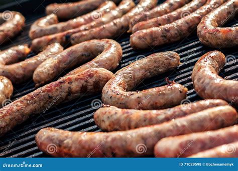 BBQ with Fiery Sausages on the Grill. Red Baked Delicious Juicy ...