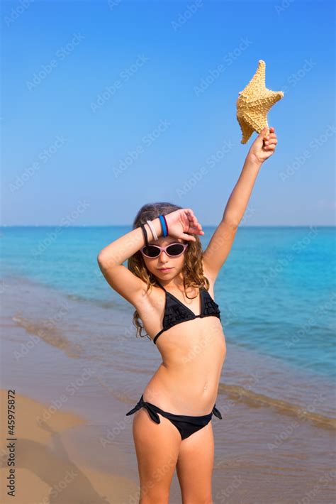 Blue Beach Girl With Bikini Starfish And Sunglasses Stock Photo Adobe Stock