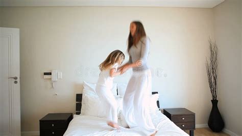 Mother And Daughter Jumping On A Bed Stock Video Video Of Daughter