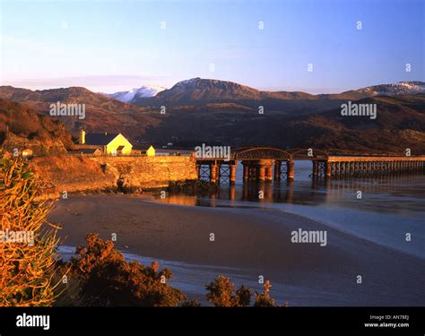 Barmouth Bridge and Mawddach estuary at winter sunset, looking to Cader ...