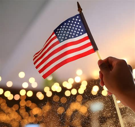 Premium Photo LOW ANGLE PHOTO OF HAND HOLDING USA FLAG AND BOKHE