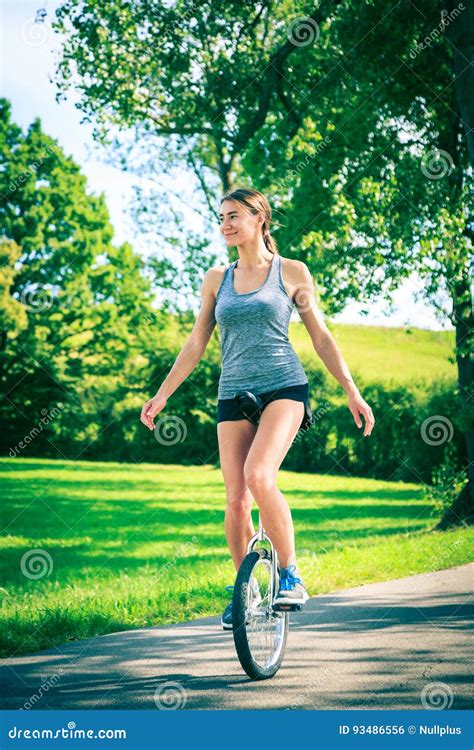 Young Woman Riding Her Unicycle Stock Photo Image Of People Colors