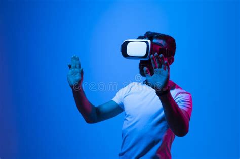 Bearded Brunette Man In White T Shirt Wearing Virtual Reality Goggle