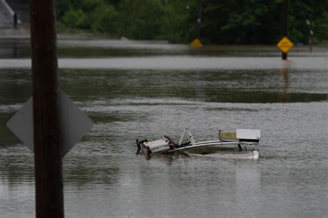 Four people missing as record rainfall causes widespread flooding in ...