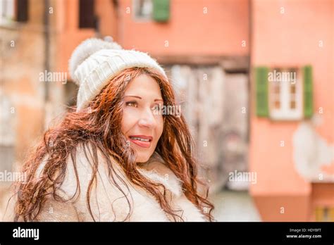 Mature Woman Smiling With City Canal In The Background Stock Photo Alamy