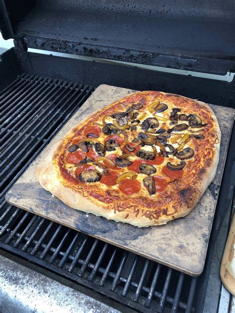 Pizza stone on the grill. : Pizza