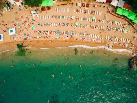 Top View Of Beach Aerial View Of Sandy Beach With Tourists Swim Stock