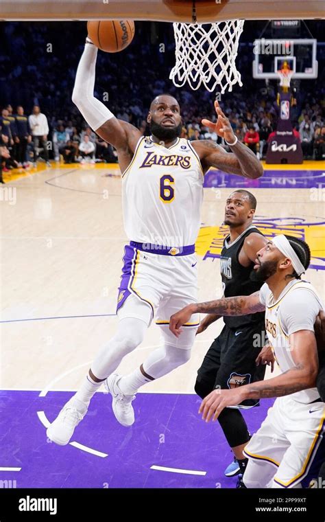 Los Angeles Lakers Forward LeBron James Left Goes Up Fr A Dunk As