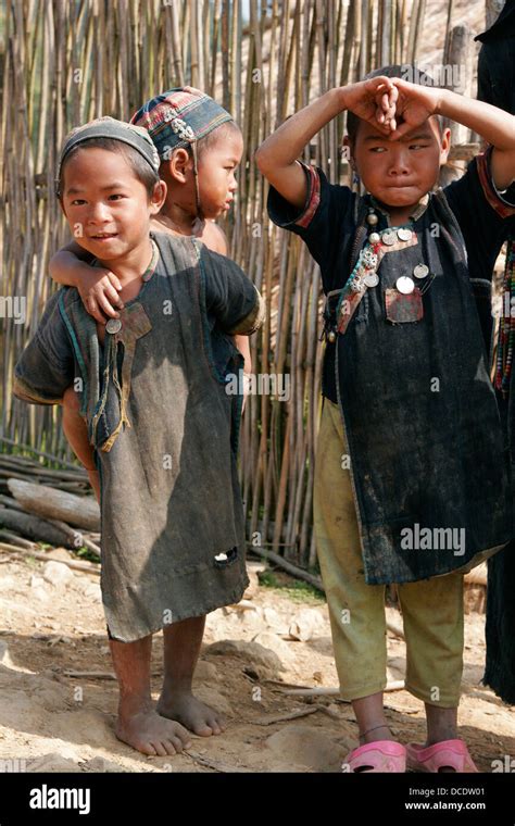 Ethnic Akha Children Wearing Traditional Clothes In Tribal Village Near