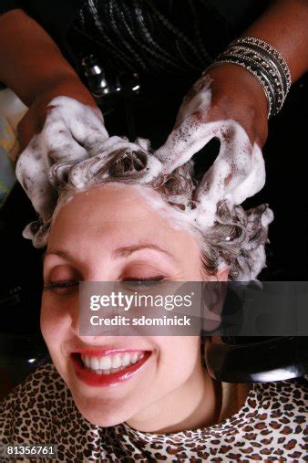 A Happy Smiling Woman Getting Her Hair Shampooed High Res Stock Photo