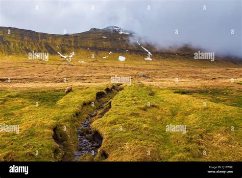 Mountain landscape on the island of Eysturoy. Cloudy spring day ...