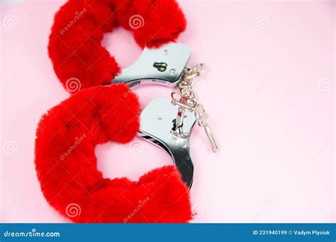 Red Fluffy Handcuffs With Keys On A Pink Background Stock Image Image