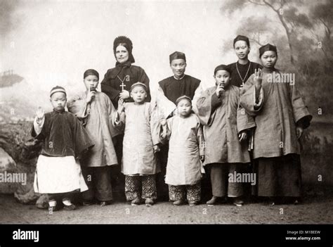 Christian missionaries and school children, China c.1890's Stock Photo