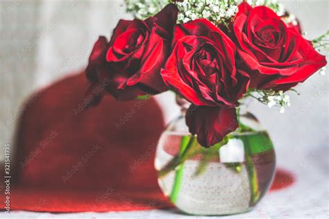 bouquet of red roses in a vase Stock Photo | Adobe Stock