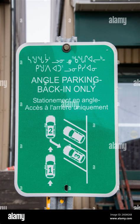 Multilingual angle parking sign in English, French and Inuktitut on ...