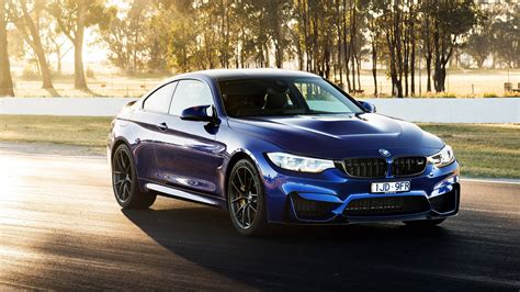 Download Blue BMW M4 CS Wallpaper | Wallpapers.com