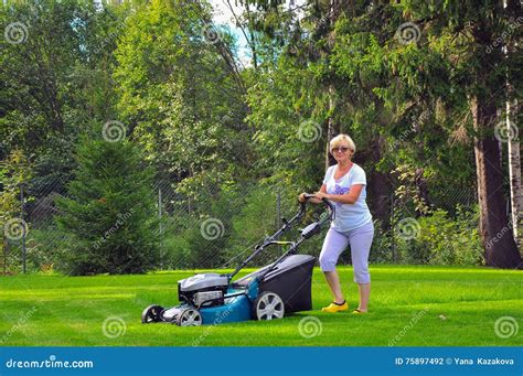 Woman Is Mowing Her Lawn With Lawn Mower Stock Photo Image Of