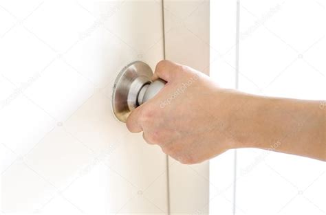 Hand opening door knob,white door Stock Photo by ©weedezign 68386537