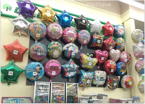 A Bunch Of Balloons Are Hanging On The Wall