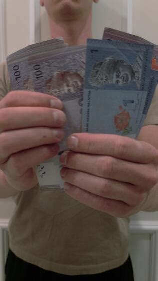 Man Counting The Malaysian Ringgit The Currency Of Malaysia Close Up