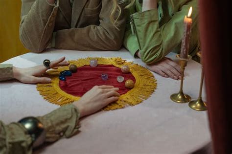 Deck of cards and candles with crystals for divination · Free Stock Photo