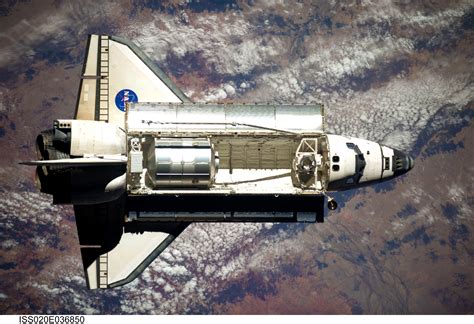 ESA - Space Shuttle Discovery approaches ISS for rendezvous and docking